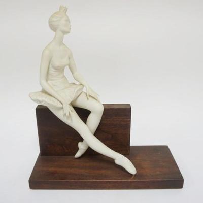 Sale Photo Thumbnail #115: 1115	CYBIS BISQUE *ON-CUE* BALLERINA MOUNTED ON WOOD BASE, APPROXIMATELY 13 IN H

