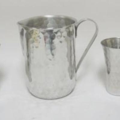 Sale Photo Thumbnail #137: 1137	VINTAGE MID CENTURY MODERN HAMMERED ALUMINUM DRINK SET, 8 IN PITCHER WITH 6 MUGS
