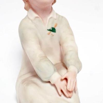 Sale Photo Thumbnail #111: 1111	LASZLO ISPANKY FIGURINE OF YOUNG GIRL SITTING, APPROXIMATELY 7 IN H
