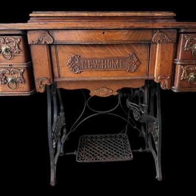 Antique 1899 New Home Treadle Sewing Machine in Ornate Oak Cabinet with Manual