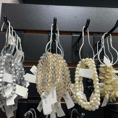 assortment of white/black beaded bracelets