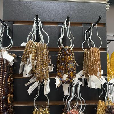 assortment of brown/cool toned beaded bracelets
