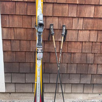 K2 Escape 5500 skis with bindings and ski poles. 