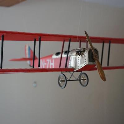 vintage model plane. plastic construction with metal wheels and wooden propeller 