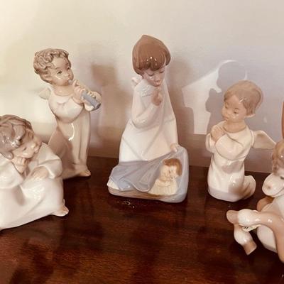 Sale Photo Thumbnail #21: Lladro: Thinking angel, Praying Angels, Donkey in Love, Angel with Child
