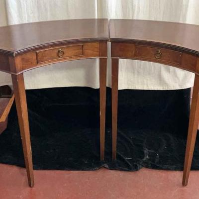 Pair of mahogany leather topped crescent tables