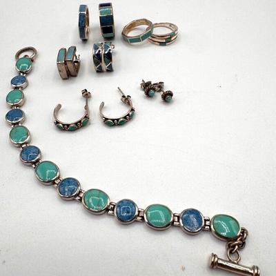 Collection of sterling silver jewelry featuring inlaid blue and green stones