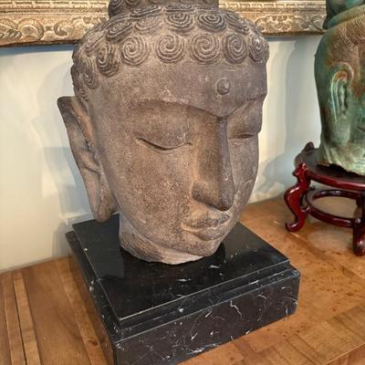A large stone Buddha head, Indonesian, pre-1700