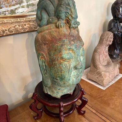 A large bronze head of the Lucky Buddha, Chinese, pre-1700