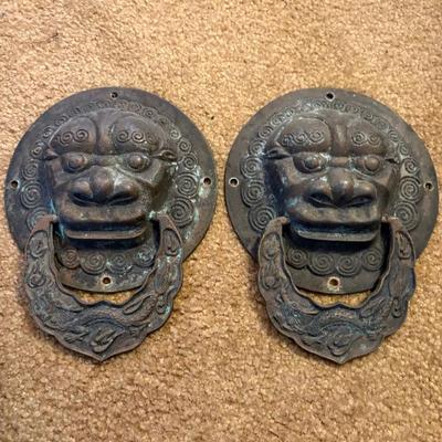 a pair of antique Chinese bronze door knockers