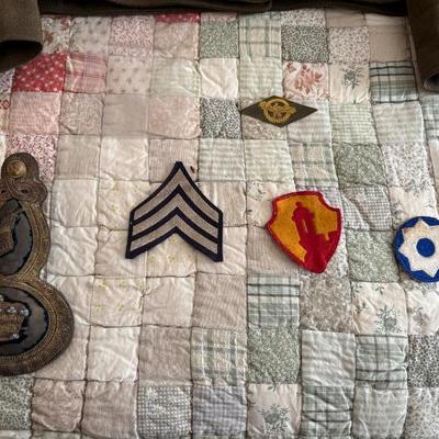 antique military items, including an 1880s US Navy dress tailcoat, epaulets, patches, and other jackets and headgear