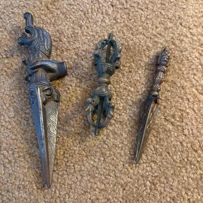 a collection of antique Thai phurbas in wood and bronze, Buddhist monks used phurbas to dispel evil spirits from the ground during planting
