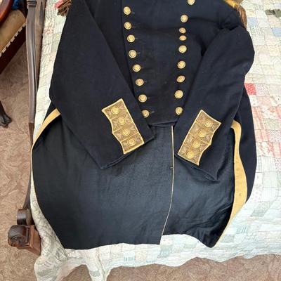 antique military items, including an 1880s US Navy dress tailcoat, epaulets, patches, and other jackets and headgear