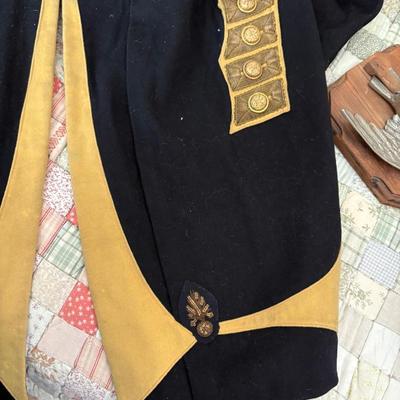 antique military items, including an 1880s US Navy dress tailcoat, epaulets, patches, and other jackets and headgear