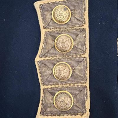 antique military items, including an 1880s US Navy dress tailcoat, epaulets, patches, and other jackets and headgear