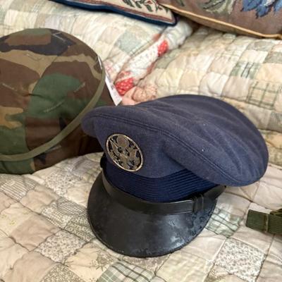 antique military items, including an 1880s US Navy dress tailcoat, epaulets, patches, and other jackets and headgear