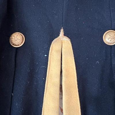 antique military items, including an 1880s US Navy dress tailcoat, epaulets, patches, and other jackets and headgear