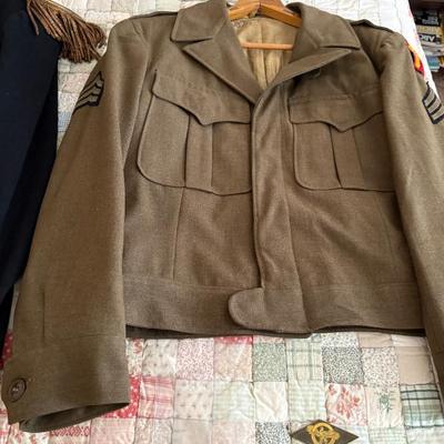 antique military items, including an 1880s US Navy dress tailcoat, epaulets, patches, and other jackets and headgear