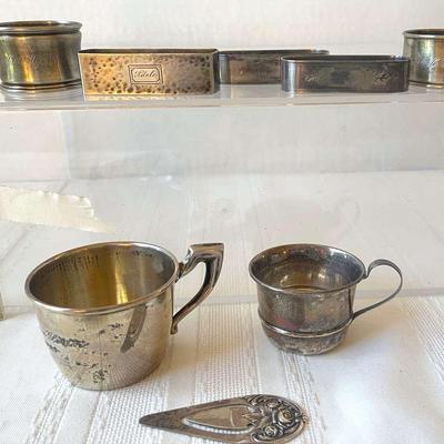 2 Sterling Baby Cups, 5 Sterling Napkin Rings And A Sterling Bookmark