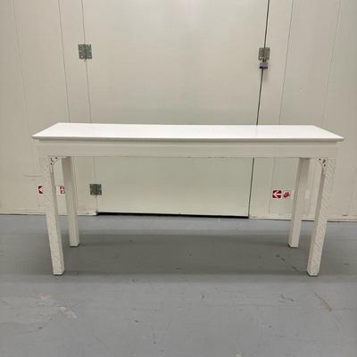 Distressed White Console Table | Distressed console table crafted from wood and finished in white paint, featuring classic decorative...