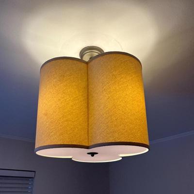 Visual Comfort Light Fixture | Visual Comfort ceiling mount light fixture featuring a sleek lampshade design concealing three bulbs,...