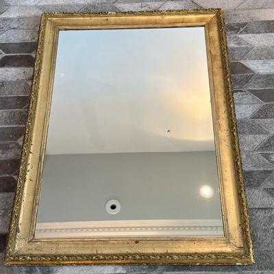 Ornate Gold-Gilt Framed Wall Mirror | Ornate rectangular wall mirror with a gold-gilt frame and dual wire hangers for horizontal or...