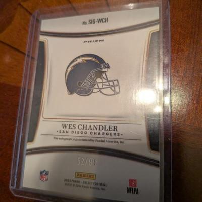 This is a rare, limited edition collectible featuring an authentic signature from former NFL player Wes Chandler. The card is from the...