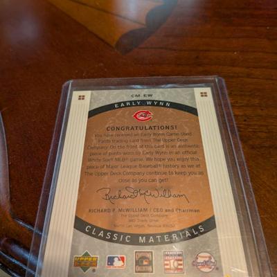 A unique piece of baseball history! This card contains a piece of authentic game-used material from Hall of Famer Early Wynn's...
