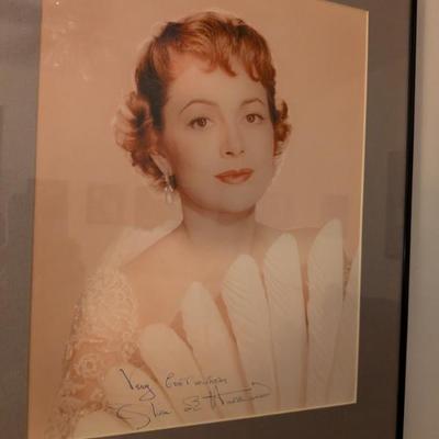 Framed color photo with a signature that appears to be from Silvana Mangano, a popular Italian film star.