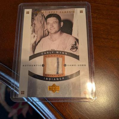 A unique piece of baseball history! This card contains a piece of authentic game-used material from Hall of Famer Early Wynn's...