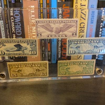 A stunning display for any aviation or stamp enthusiast, this framed collection features six vintage US Air Mail stamps. Issued in the...