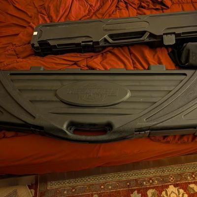This is a heavy-duty, hard-shell gun case, likely capable of holding two rifles or shotguns. With its rugged construction and thick,...