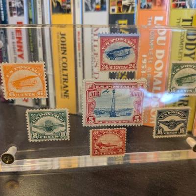 This is a beautiful and unique collection of vintage US Air Mail stamps from the 1920s and 1930s. Displayed in a clear acrylic frame,...