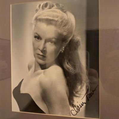 Framed black-and-white photo with a signature that appears to be from Claire Trevor, an Academy Award-winning actress known as the...