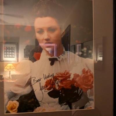 Framed color photo with a signature that appears to be from Jane Wyman, a versatile actress and singer who won an Oscar and was the first...
