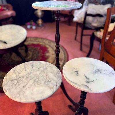 Lot 147:  A Trio Marble Topped Plant Stands