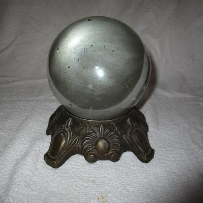 Sale Photo Thumbnail #87: Crystal Ball on ornate metal stand.