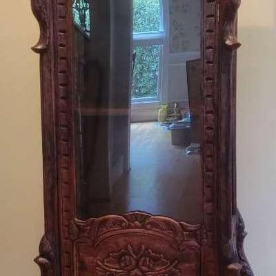 Ornately Carved Wooden Cabinet with Glass Door