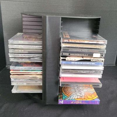 Classical, Jazz, Country, And Other CDs With Rotating CD Holder