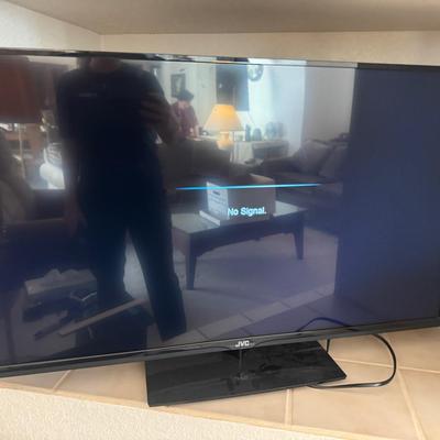 JVC Television on Stand With Remote