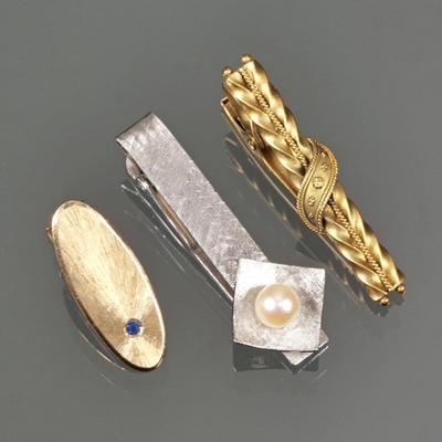 (3pc) 14K GOLD TIE CLIPS | Including a brushed 14k white gold tie clip set with a single round white pearl, marked M&N (approx. 1.5...