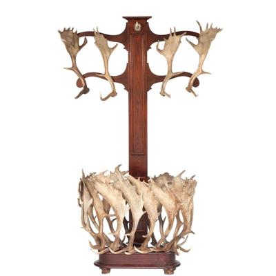 ANTLER MOUNTED COAT RACK / HALL TREE | 20th century, having four antlers mounted as coat hooks on scroll arms, the lower section with...