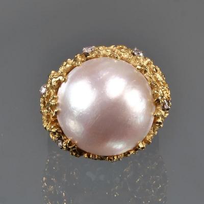 PEARL & DIAMOND 18K GOLD RING | Cocktail ring designed as a large mabe pearl in a bold yellow gold setting, with 6 small diamonds...