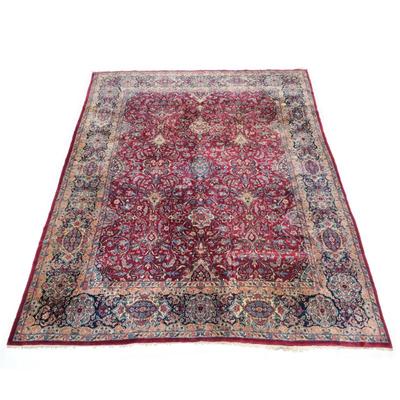 ANTIQUE PERSIAN LAVAR KIRMAN |Persian Kirman Laver rug, having a maroon ground filled with scrolling arabesques and floral sprays in an...