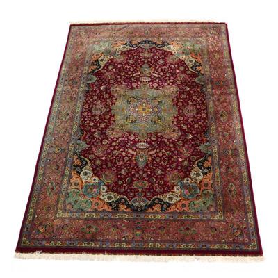 VERY FINE SCULPTED FLORAL TABRIZ RUG | central medallion with four vases full of flowers on a red ground, peach & cream border with...