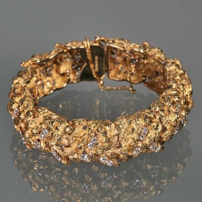 ST. GEORGE 18K GOLD & DIAMOND BRACELET | 18k yellow gold flexible link bracelet, set with 55 diamonds (tested), marked 'St. Geo....