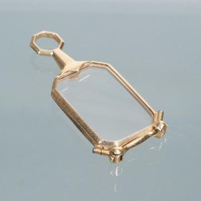 TIFFANY & CO. 14K GOLD LORGNETTE | marked "14k" and "TIFFANY & Co."
Total weight: 12.6 g
h. 2.5 x w. 1 in.
