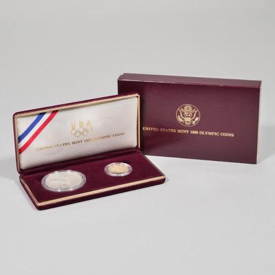 UNITED STATES 1988 OLYMPIC COINS | Including 11988 proof silver dollar coin (0.86 ozt) and 1 gold five dollar coin (8.4 grams)
