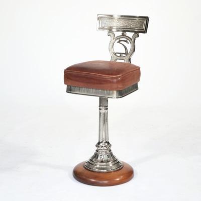 EARLY 1900'S CAST IRON & LEATHER SWIVEL CHAIR | Polished cast iron, on swiveling round base; seat height: 25in.
h. 35 x w. 14.5...