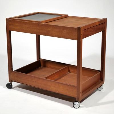 MID CENTURY DANISH TEAK BAR CART | Having 2 shelves, small drawer, and movable top shelf revealing lower storage
h. 28 x w. 19 x l. 31.5 in.